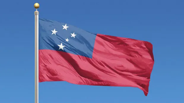 Joanya Tafua holding the American Samoa flag