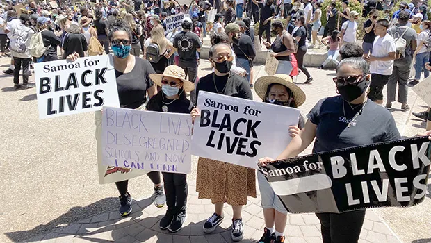 Leiataua Family members with Samoa for Black Lives Matter signs