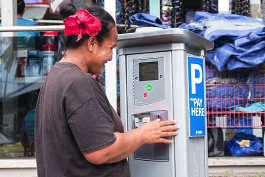  A member of the public takes a closer look at one of the parking meters