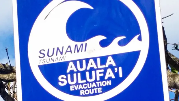  A sign directs people to the tsunami escape route on Samoa's Lalomanu Beach.