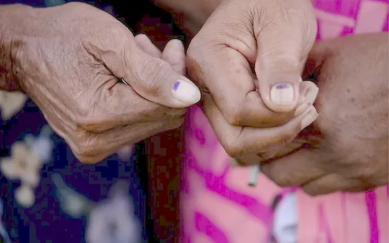 Voters showing the mark indicating they had voted