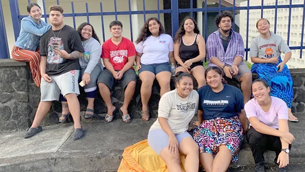 Some Samoana high school seniors waiting to take part in their photo shoot outside the Lee Auditorium.