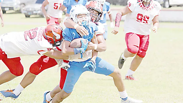Samoana Sharks ball carrier is brought down near mid field by Joseph Umu (3)