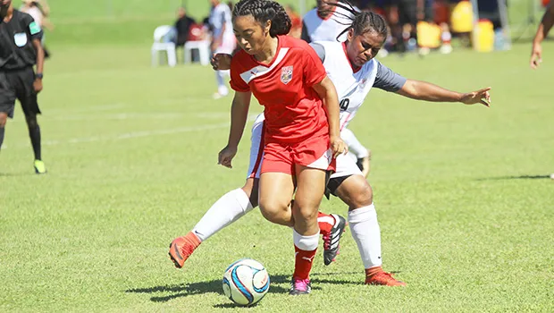 Saono Enesi of American Samoa dribbles the ball