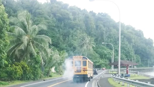 School bus spewing white smoke