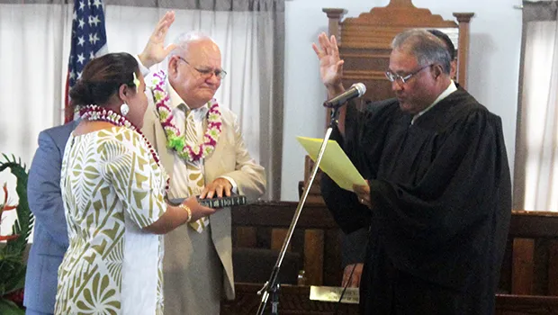 Chief Associate Judge Mamea Sala Jr., administers the oath of office to Logoai Siaki Logoai