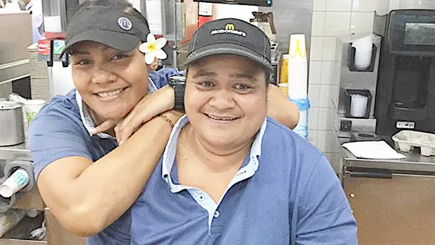 Two smiling McDonald's servers