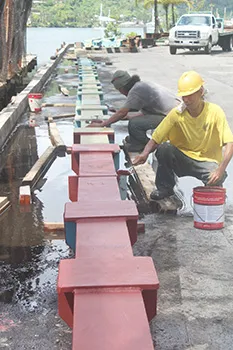 Ronald Reagan Shipyard workers painting the new beams