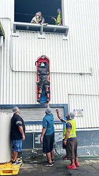 STARKIST training exercise lowering man from second story