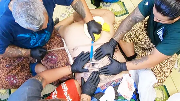 Loren Asaeli getting a traditional Samoan tatau