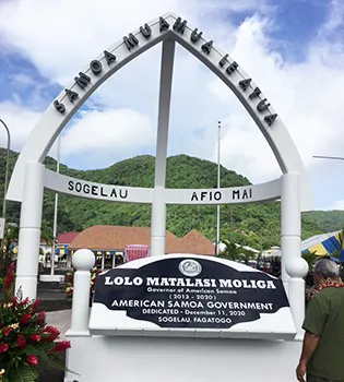 The Archway and one of the two monuments — this one dedicated to Gov. Lolo Matalasi Moliga