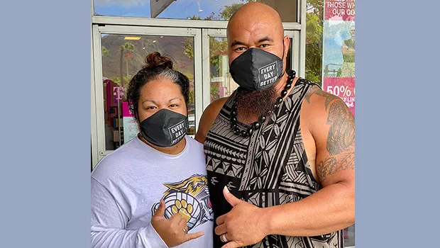 Isaac and Mrs Sopoaga with protective masks on 