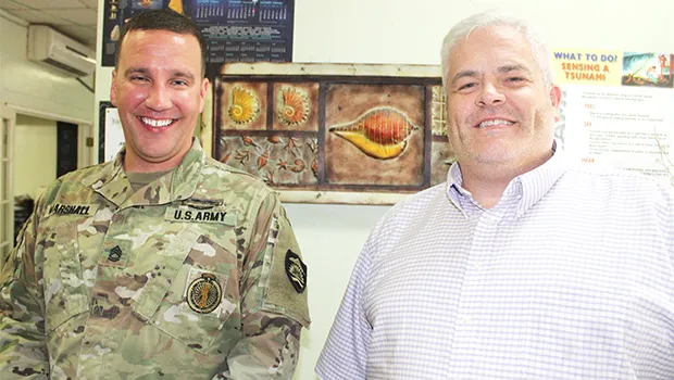 Neil Woolf (right) with Sgt. First Class Nick Marshall