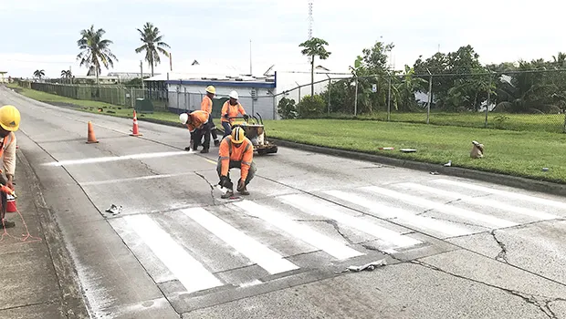 McDow workers completing crosswalk stripping at South Pacific Academy