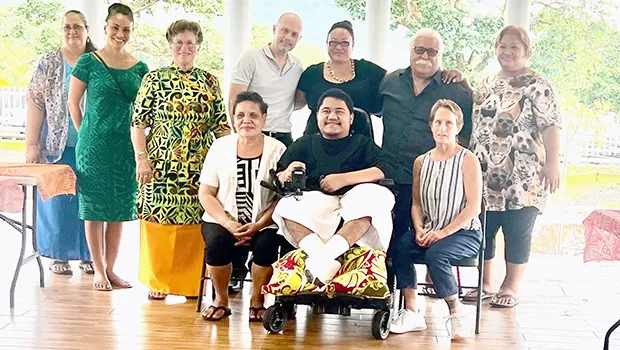 Alofaeleuma Faualo with his new wheel chair and supporters