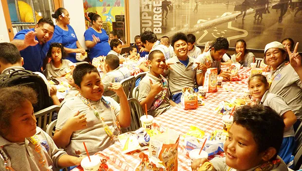 Manulele SPED students enjoying burgers at Carl's Jr.