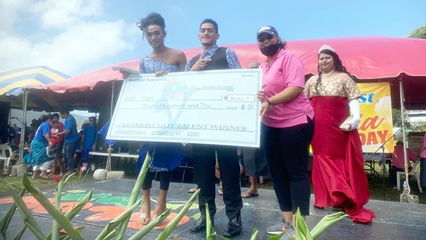 Vaasili Tauvale (far left) and partner Konefesi Talavou (center)