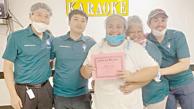  Pictured here is a smiling Toaiva Ueli with management staff, led by Starkist Samoa General Manager Jason Kim.