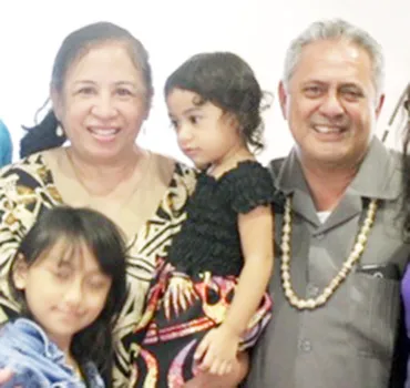 Rep. Su’a Alexander Eli Jennings (right), pictured with his wife and children
