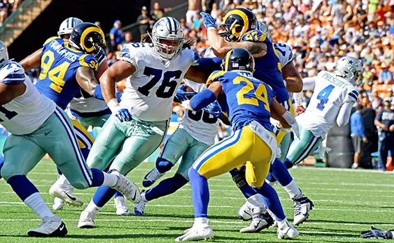 Offensive Guard, Xavier Sua-Filo, protects his QB Dak Prescott 