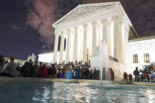 People gather at the Supreme Court Friday, Sept. 18, 2020, in