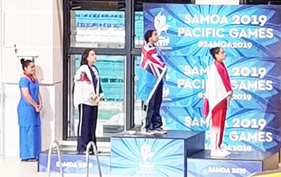 Tilali Scanlan on the pdoium after winning her silver medal with gold winner Moana Wind and bronze, Poerani Bertrand