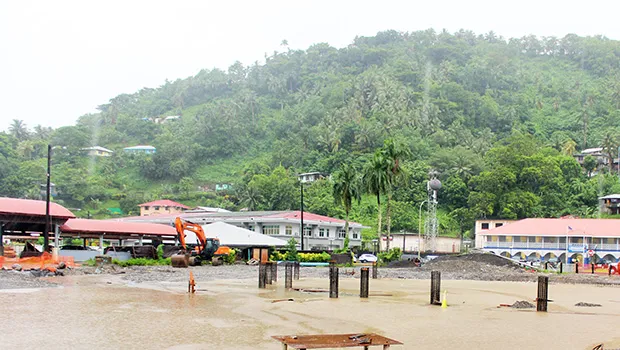 Water standing amid pilings at new Fono building site