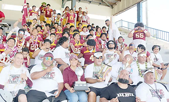 The Warriors football team and coaches