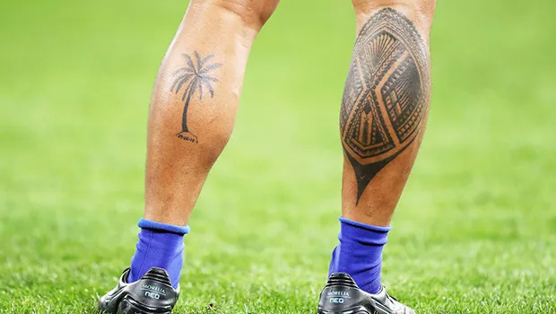 Tattoos on legs of rugby player