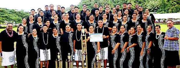 the Samoana Sharks — pictured with their choir director, Pati Pati (left) and school principal Rod Atafua (right)