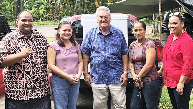 Henry Tavake donating a freezer to Hope House