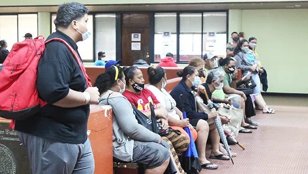 Tax filers wait for their turn at the Tax Office