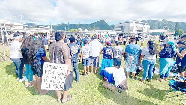 Striking SPA teachers with their supporters outside of the school.