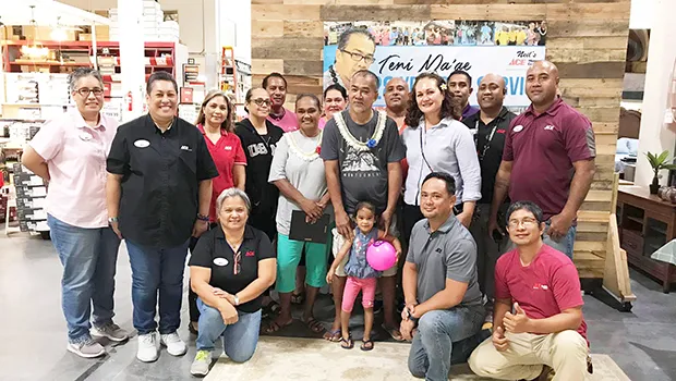 Teni Ma'ae (center) with ACE empolyees wishing him well