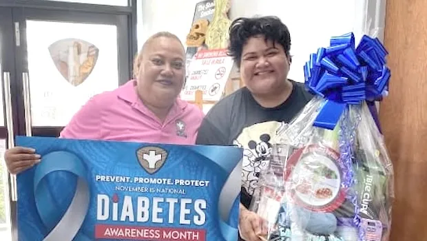 Tisa Reed receiving her Self Care Fridays Challenge prizes