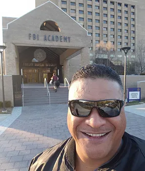 Lt. Tolia Tanu Solaita Jr. in front of FBI Academy
