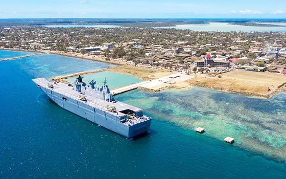  The HMAS Adelaide sitting alongside a wharf in Nuku'alofa 