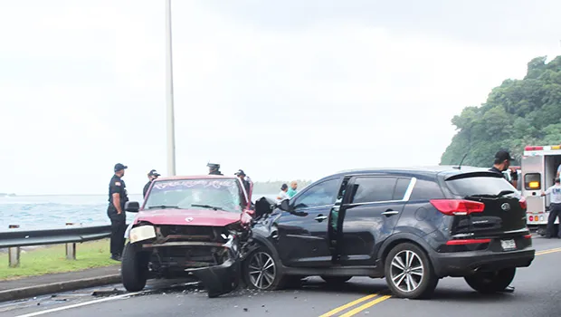 two cars at side of road with damage