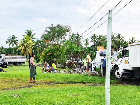 garbage truck after it cashes into rock wall