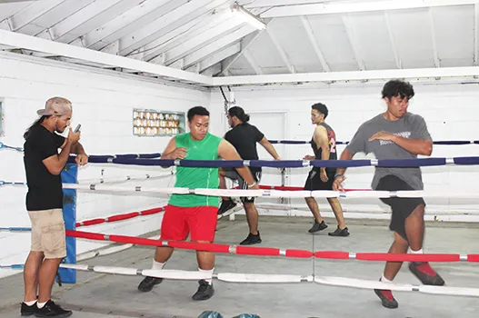 Boxers in a training session in the ring