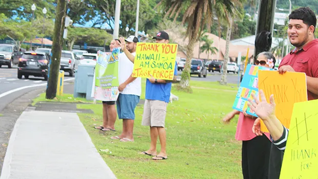 TTFAAS members wave a thank you