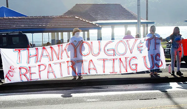 TTFAAS members with thank you banner waving to drivers passing by