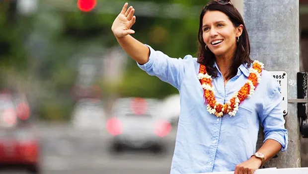  Gabbard sign-waving during a Congressional campaign event in Hawaii.