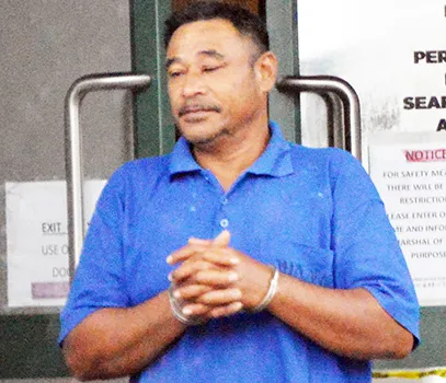 Tusi Fala in handcuffs after his initial appearance in court 