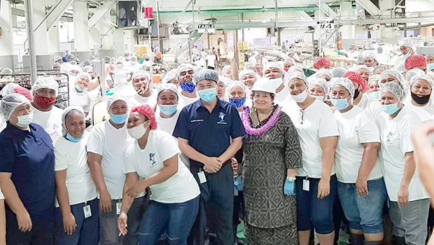 Amata with StarKist workers on the canning floor