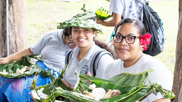 South Pacific students getting ready to enjoy an umu meal they helped prepare