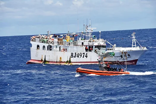 USCG boarding crew heading toward a foreigh vessel