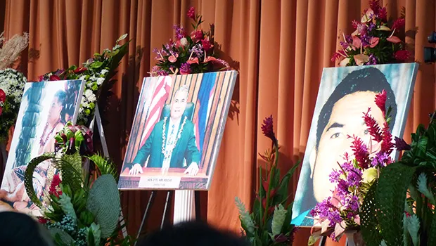  three enlarged photos of him, including one during his brief time as Saole senator.