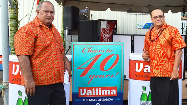 Latu Kupu and Afa Young showing off “Vailima, Samoa’s Own Beer” special signage