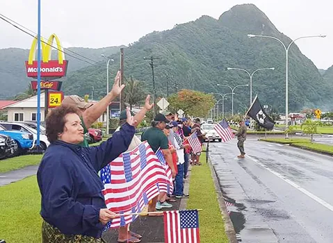 Amata and Veterans wave the U.S. Flag on Veterans Day 2020